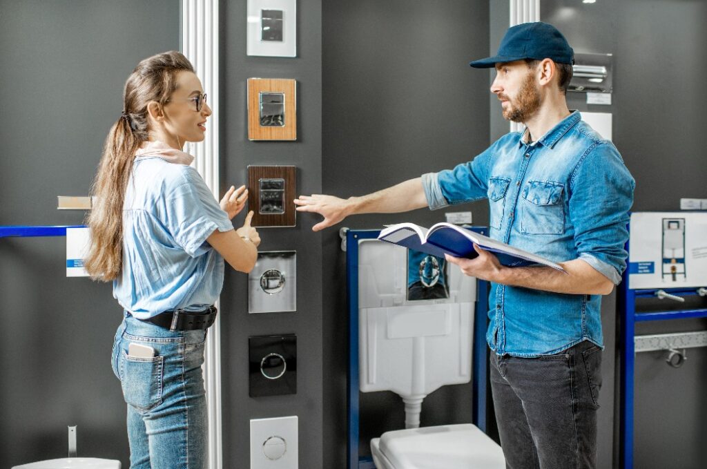 Man and woman choosing new plumbing in the shop